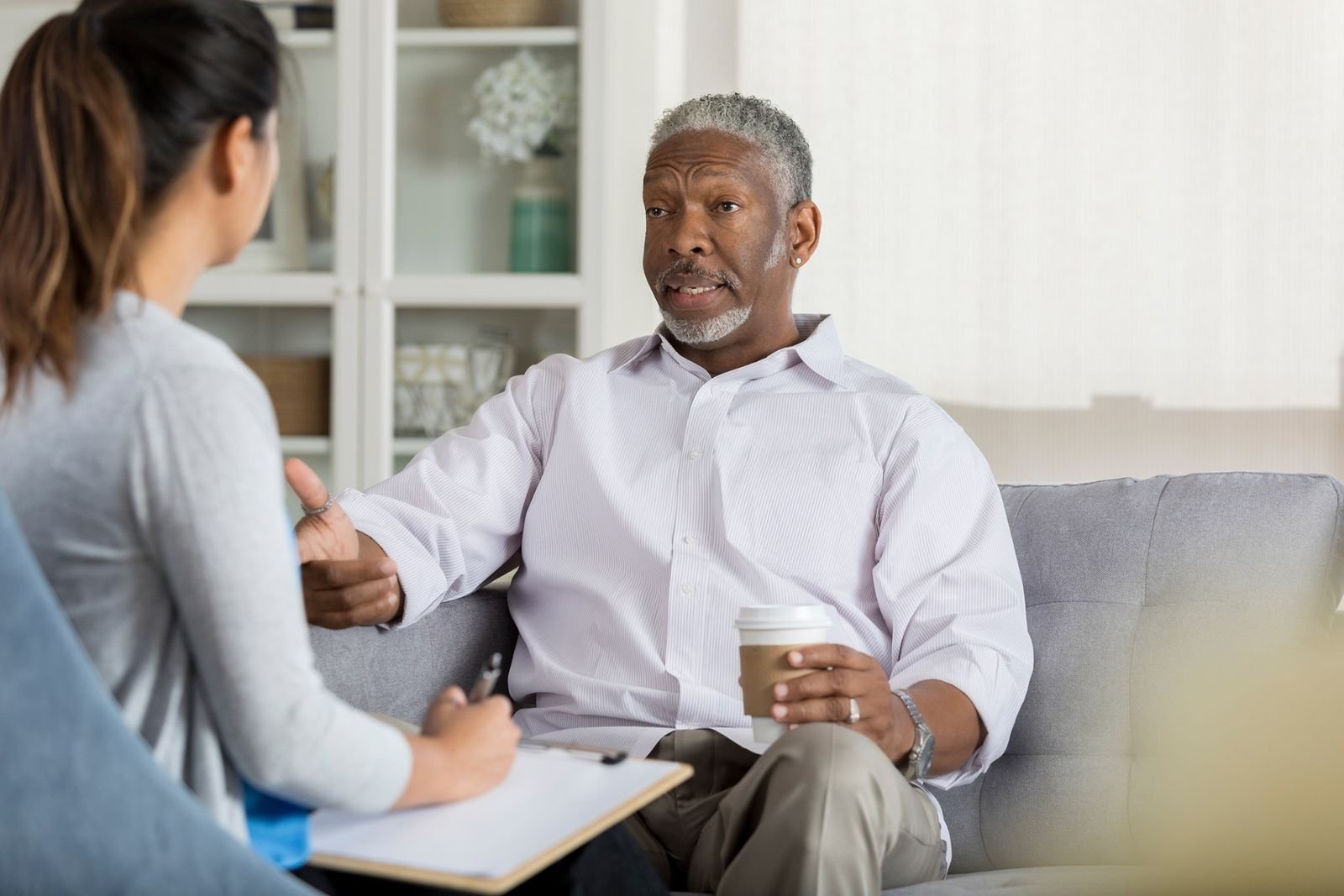 An RHHS clinician meeting a client at home